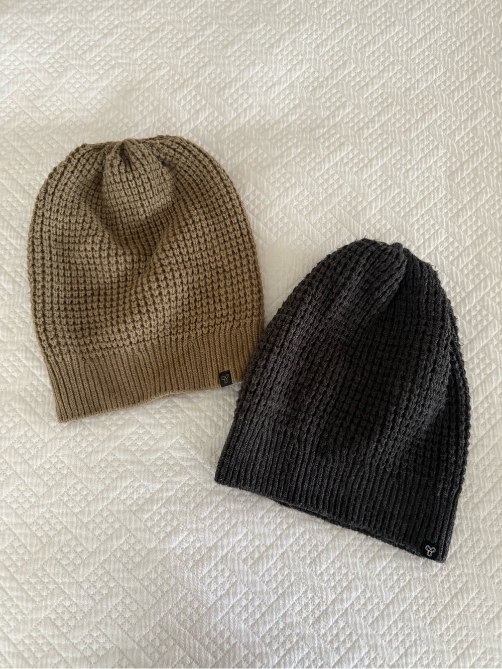 Two TNA Aritzia Toques